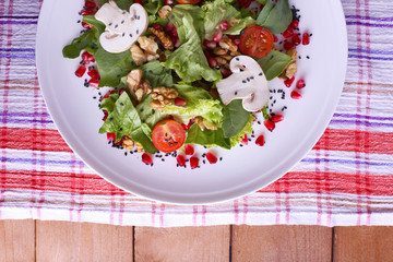 Fresh salad with greens, garnet and spices
