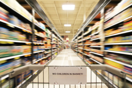 a blurred shot of an isle in a supermarket or grocery store shop