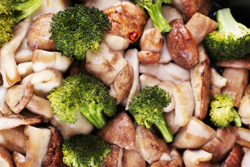 Braised wild mushrooms with vegetables and spices close-up