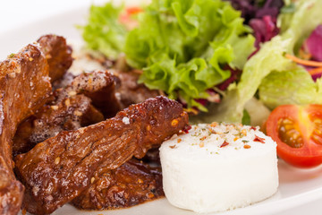 grilled beef stripes fresh salad and goat cheese