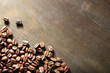 Coffee beans on wooden background