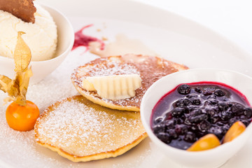 tasty sweet pancakes with vanilla icecream and topping