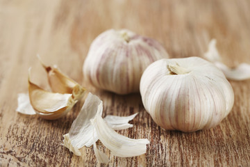 Raw garlic on wooden table