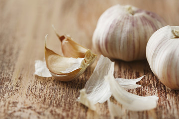 Raw garlic on wooden table