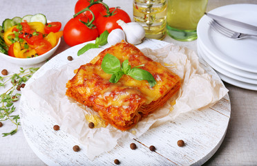 Portion of tasty lasagna on table