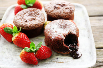 Hot chocolate pudding with fondant centre with strawberries,