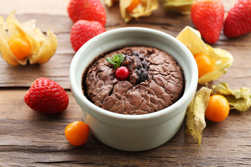 Hot chocolate pudding with fondant centre on table, close-up