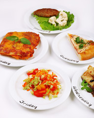 Daily menu. Plates with food on table