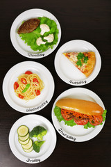 Daily menu. Plates with food on table