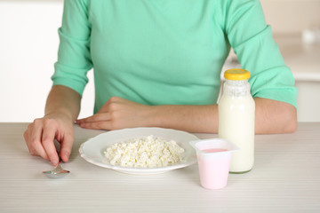 Girl and dietary food at table close-up