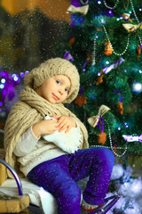 the girl near a Christmas fir-tree 3