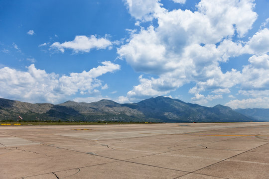 Runway of Dubrovnik Airport on a background of mountains.