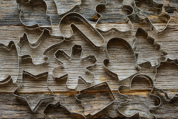 Holiday Cookie Cutters on Rustic Wood Background