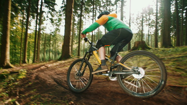 Mountain Biker Riding On Forest Trail in slow motion