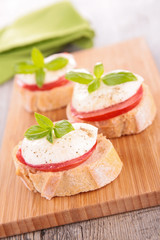bread with tomato, mozzarella and basil