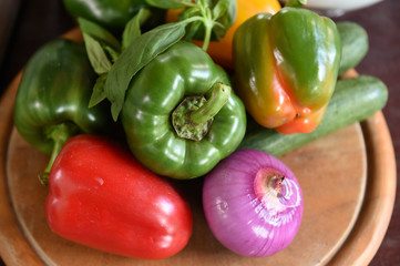 Ingredients for pizza on a wooden board.
