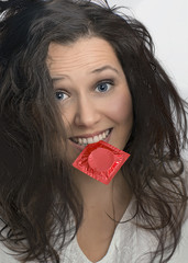 Girl with  with red condom pack