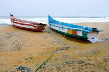 Fishing boats beached along the coast  in Mamallapuram, India