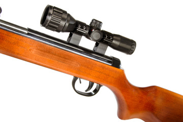 air rifle with a telescopic sight and a wooden butt