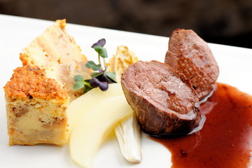 Venison meat steak with Quiche pie, Port Sauce,herbs and Potato