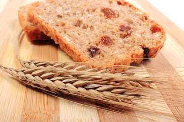 Fresh baked bread and ears of wheat