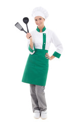 happy woman in chef uniform with kitchen tools - full length iso