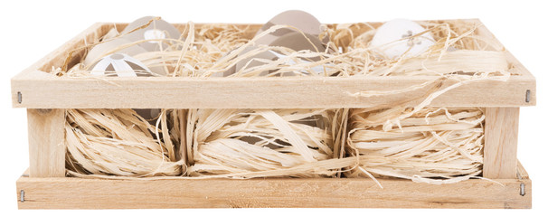 painted eggs in a wooden crate isolated