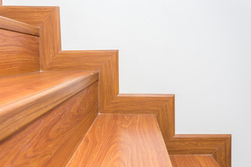 Obraz na płótnie Canvas wooden staircase made from laminate wood in white modern house