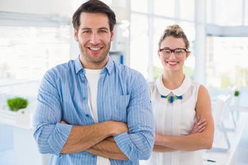 Fototapeta premium Smilling photo editor posing with arms crossed