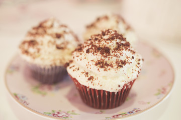 Young woman chef cooking cake in kitchen