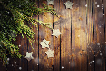 Spruce branches on  wooden background.
