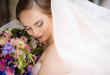 Obraz na płótnie Canvas Close up of bride face with veil