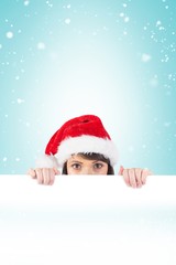 Festive brunette holding a poster