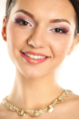 Portrait of a delicate woman wearing make up and jewelry