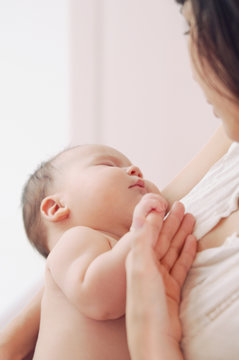 portrait of a mother with her newborn baby