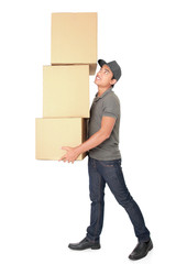 Man Holding some heavy Stack Of Cardboard Boxes