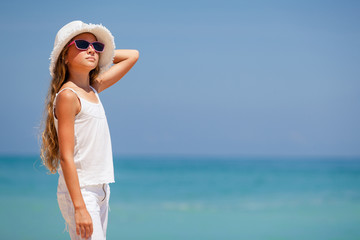 teen girl standing on the beach at the day time