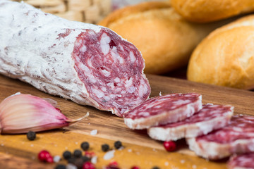 sliced salami on wooden board