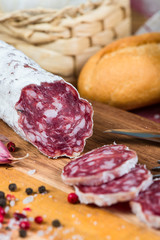 traditional mediterranean sausage slicen on wooden board