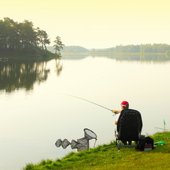 Obraz na płótnie Canvas Fisherman fishing. Feeder sport. 