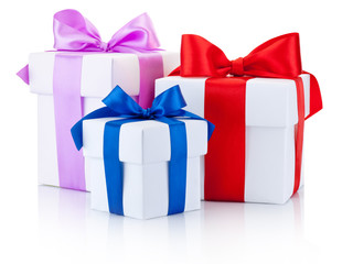 Three White boxs tied with colored satin ribbons bow Isolated on