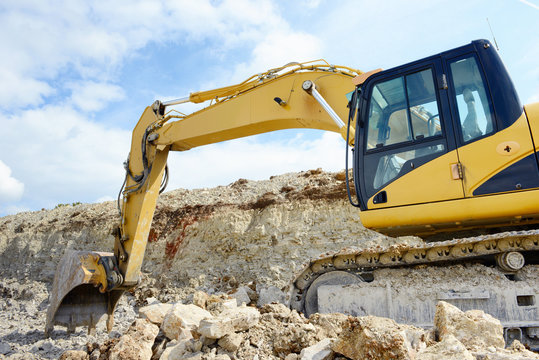 limestone quarry with earth mover