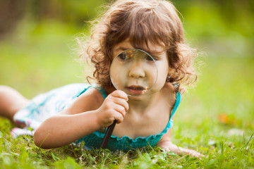 Kid with magnifying glass