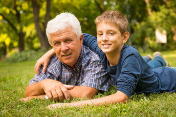 Grandfather and grandson in the park