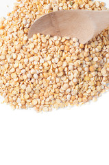 buckwheat isolated with a wooden spoon on white background