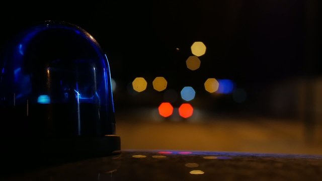 close-up of flashing light on a police car