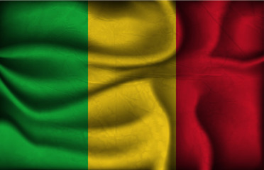 crumpled flag of Mali on a light background