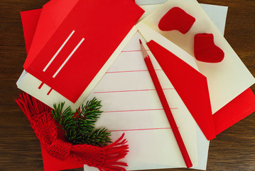 Letter twith envelopes, red pencil and Christmas tree