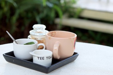 Cup of coffee and sugar on the table.