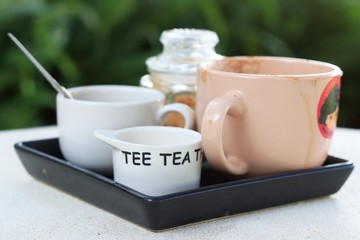 Cup of coffee and sugar on the table.
